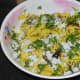 Step nine: Garnish with grated coconut and finely chopped coriander leaves. Serve for breakfast or an evening snack. Enjoy the taste!