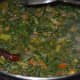 Step seven: Add two cups of water. Stir well. Cook till the veggies become soft and combine well. Simmer until the curry attains a soft texture. Add remaining salt. Mix well. Turn off the stove.