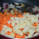 Step three: Throw in chopped potatoes and carrots. Add some salt. Stir-cook on a high-heat for three minutes.
