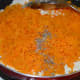 Step four: Add sauteed carrot, crushed cardamom, and remaining ghee. Mix very well.