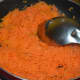 Step two: Saute the grated carrot with ghee for 5 minutes or until it becomes almost dry. Transfer it to a plate.