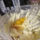 Adding the eggs and vanilla extract.