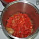Cooked tomatoes releasing juices.