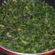 Step three: Spread chopped coriander leaves out in the sun for 2-3 hours. Next, saute the leaves over low heat just to remove the excess moisture. Add it to the plate.