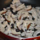 Step three: In the same pan, dry saute dry coconut slices till they become crispier. Add it to the bowl.
