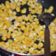 Step five: Saute corn kernels in remaining butter for 2-3 minutes. Sprinkle a few drops of water if needed.