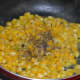 Step six: Add salt and pepper powder. Mix well. Turn off the heat.