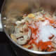 Step four: Grind sauteed dry coconut, tamarind, salt, and red chili powder together. Get a coarse powder.