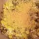 Add half and half. Stir well. Bread cubes should be submerged in half and half. Top with reserved parmesan cheese.