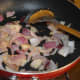 Step three: Saute onions in the same pan. Fry till they become transparent.