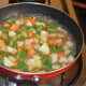 Add some water. Throw in some salt. Cover the pan and cook till the veggies are soft yet crunchy.