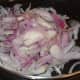 Step four: Throw in chopped onions. Stir-fry them until they turn dark golden brown.