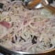 Stir-frying the onions.