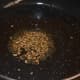 Step three: Heat oil in a pan. Saute mustard seeds and cumin seeds. Let them crackle.