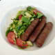 Venison sausages and salad