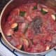 Dried mint and seasonings are added to stew