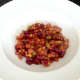 Bean salad is spooned in to serving plates