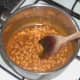 Beans are gently heated over a low heat