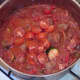 Halved cherry tomatoes are added to stew half way through cooking