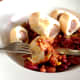Enjoying venison sausage rolls in hot and spicy bean salad