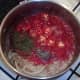 Tomatoes, chilli and spices added to softened onion