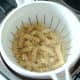 Fusilli pasta is drained