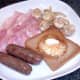 Fried breakfast elements are plated