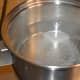 Step three: Add two tea spoons of sugar. Let the mix come to a boil. Stir the mix.