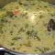 Step nine: Coconut rice/coconut pulao is ready! Now, add shallow fried/sauteed cashew nuts. Also, add chopped fresh coriander leaves.