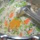 Step six: Throw in turmeric powder. Mix well.