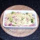 Cheese scattered over ham and sprouts