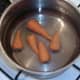 Chantenay carrots added to cold, salted water