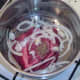 Onion and seasonings are added to ox cheek