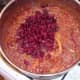 Red kidney beans are added to pot
