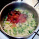 Meatballs in salsa are added to pasta and sprouts
