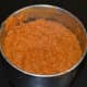 Grind, adding enough water to get a near-smooth thick sauce. Transfer it to a bowl.
