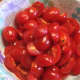 Cut cherry or grape tomatoes in half