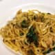 Fettuccine pasta cooked in white wine, with sauteed golden beets and greens