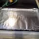 Step Seven: Line a cookie sheet with aluminum foil and spray it thoroughly with cooking spray.