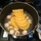 Step 1: Combine together the can of pineapple and the can of lychee in a large saucepan.