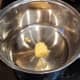 Melt some butter in a large pot on the stove over medium heat.