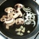 Starting to saute mushrooms, garlic and onion