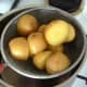 Turmeric potatoes are drained