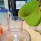 Continue processing and add your water a little at a time until it's pancake batter consistency.