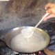 The oil starts to separate from the coconut milk.