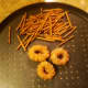 Lay out donuts and pretzels.