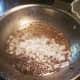 Sauté onion and green pepper in ground beef grease.