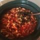 Add sautéd onion and pepper to crock-pot. Stir.