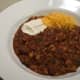 Kitchen Sink Chili with sour cream and cheese