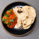 Chicken tikka masala with naan bread.